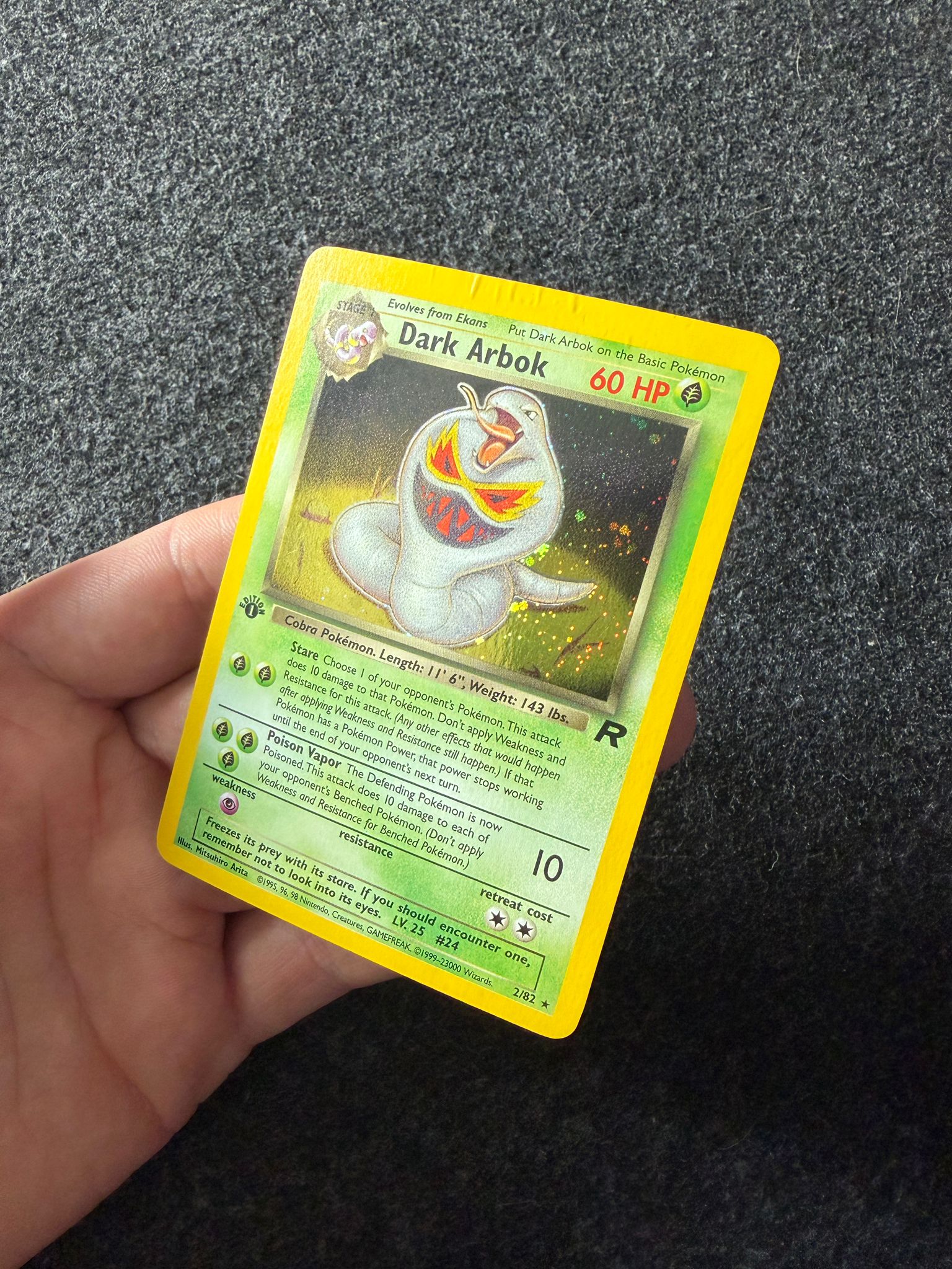 Dark Arbok Pokémon trading card before treatment at Kodap Cleans