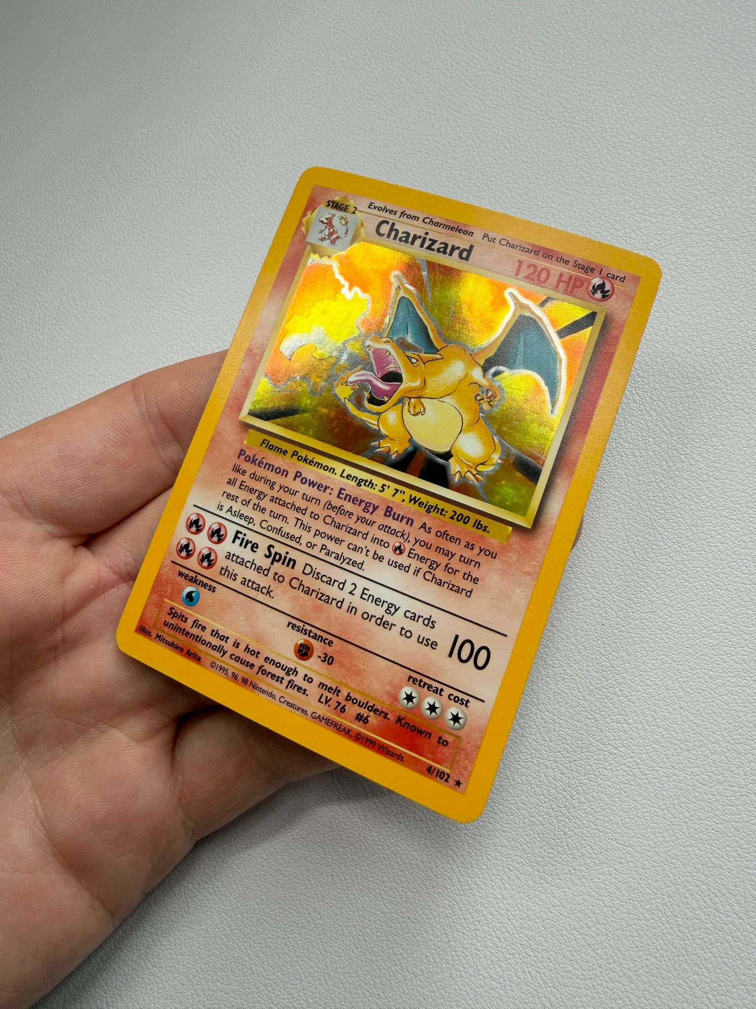 Charizard holographic Pokémon trading card after cleaning and polishing by Kodap Cleans