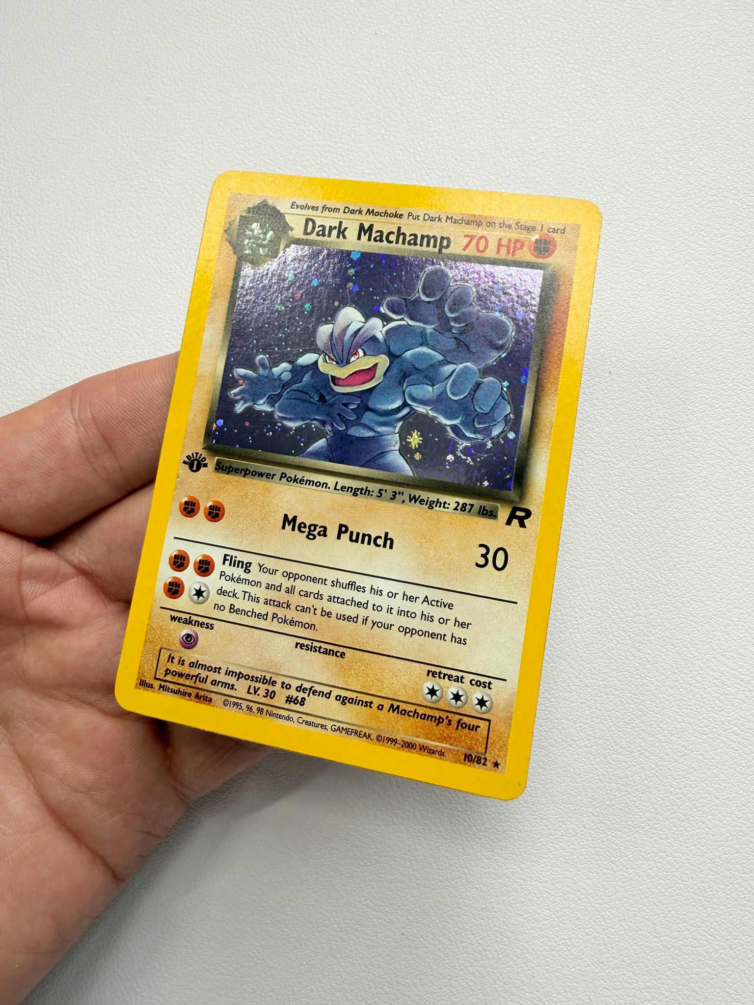 Dark Machamp holographic Pokémon trading card after cleaning and polishing by Kodap Cleans