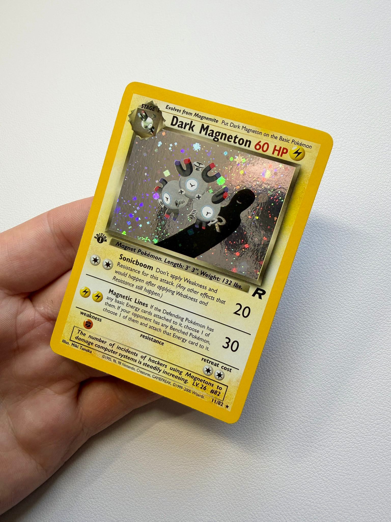 Dark Magneton holographic Pokémon trading card after cleaning and polishing by Kodap Cleans